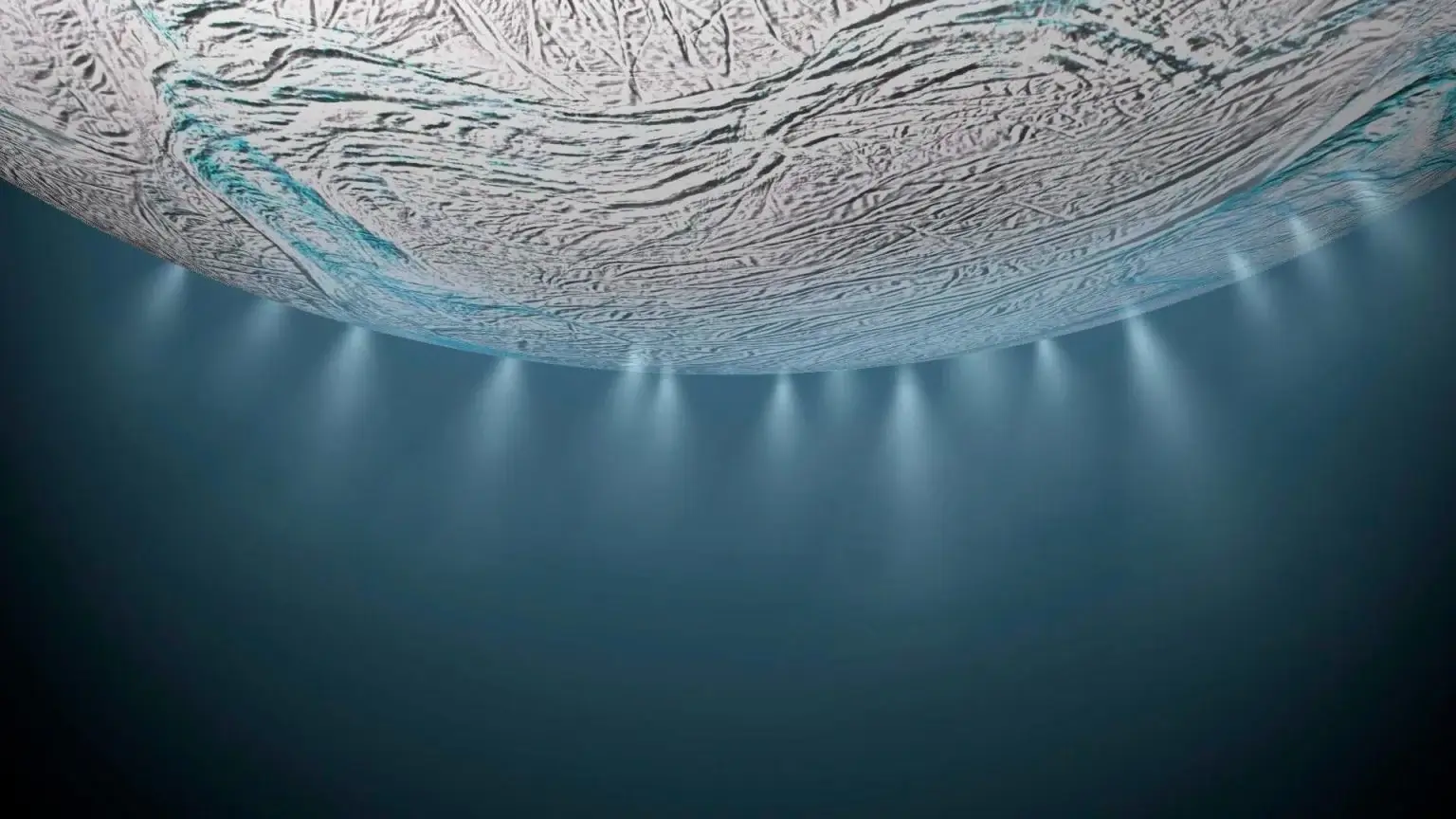 This illustration shows Saturn's icy moon Enceladus with a buildup of ice particles, water vapor, and organic molecules ejected from cracks in the moon's south polar region. Credit: NASA/JPL-Caltech
