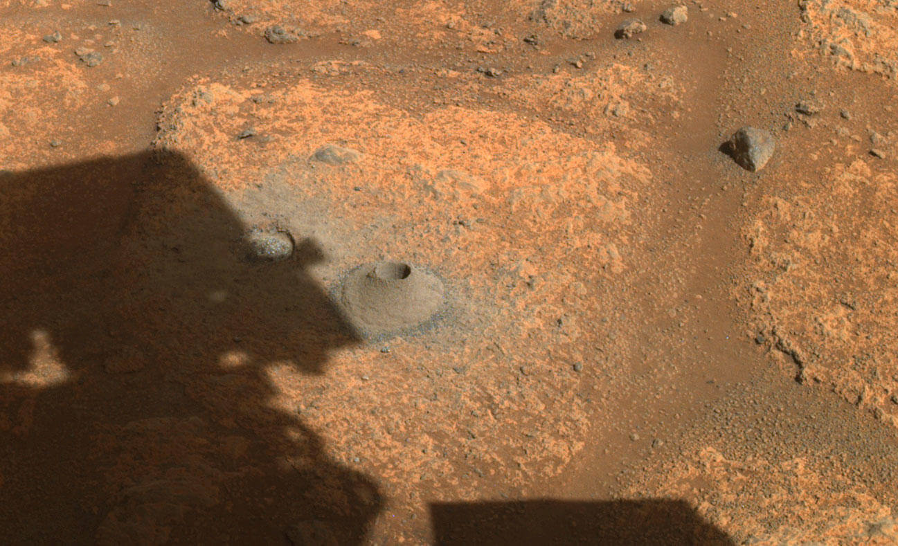 This image, taken by NASA's Perseverance rover on Aug. 6, 2021, shows the hole drilled into Martian rock in preparation for the rover's first attempt to collect a sample. It was captured by one of the rover's cameras in what the rover's science team called "cobblestone" in the area. The crater floor is broken and rough" in Jezero Crater. Credit: NASA/JPL-Caltech