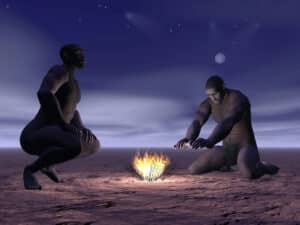 شخصان من جنس Homo erectus يجلسان حول النار. الرسم التوضيحي: موقع Depositphotos.com