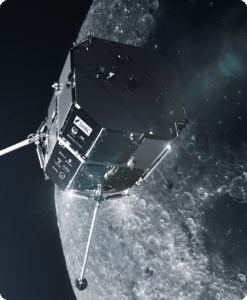 Image of a spacecraft advancing over the lunar surface with a view of craters.