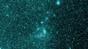 This image taken by SPHEREx shows the same region of space as the previous image at a different wavelength of 0.98 microns, but the dust cloud is no longer visible. The molecules that make up the dust – polycyclic aromatic hydrocarbons – do not emit light in this color. Credit: NASA/JPL-Caltech