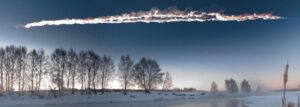 A quiet winter landscape with a meteor streak in the sky, snow, trees, and a frozen sea.