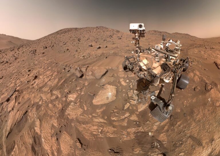 NASA's Perseverance spacecraft captured this selfie, made up of 62 individual images, on July 23, 2024. A rock called Chiave Falls—where features have been found that may indicate whether Mars was once home to microscopic life—is visible to the left of the spacecraft, near the center of the image. Credit: NASA/JPL-Caltech/MSSS