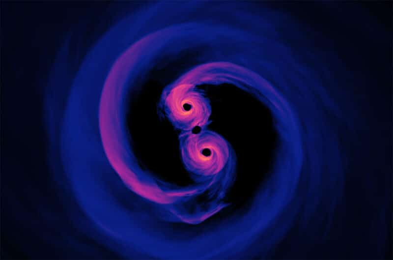 תאורטיקנים יכולים לדמות מיזוג של זוג חורים שחורים על־מסיביים, כפי שמוצג בדוגמה שלמעלה. אבל איתור מערכת כזאת בפועל התברר כמשימה קשה יותר.
קרדיט: מרכז טיסות החלל גודארד של נאס"א / סקוט נובל; נתוני הסימולציה: d'Ascoli ואח', 2018