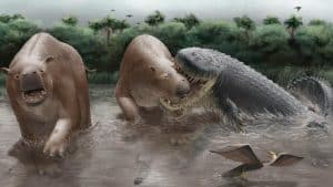 An artistic reconstruction of *Purussaurus neivensis* attacking the herbivorous mammal *Pericotoxodon platignathus* in the La Venta ecosystem of Colombia during the Miocene. The illustration is based on fossils and bite marks and is not a direct record of the event.